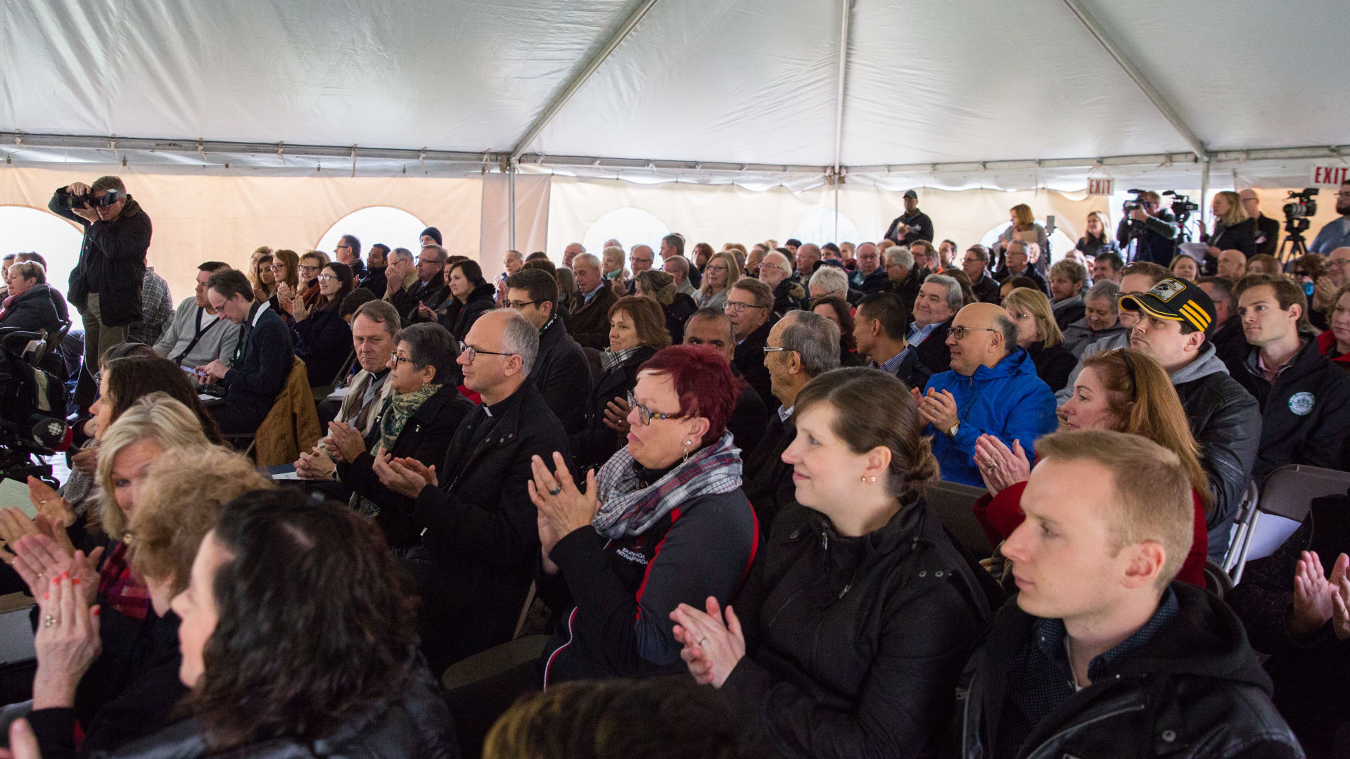 Applauding community members (Photo)